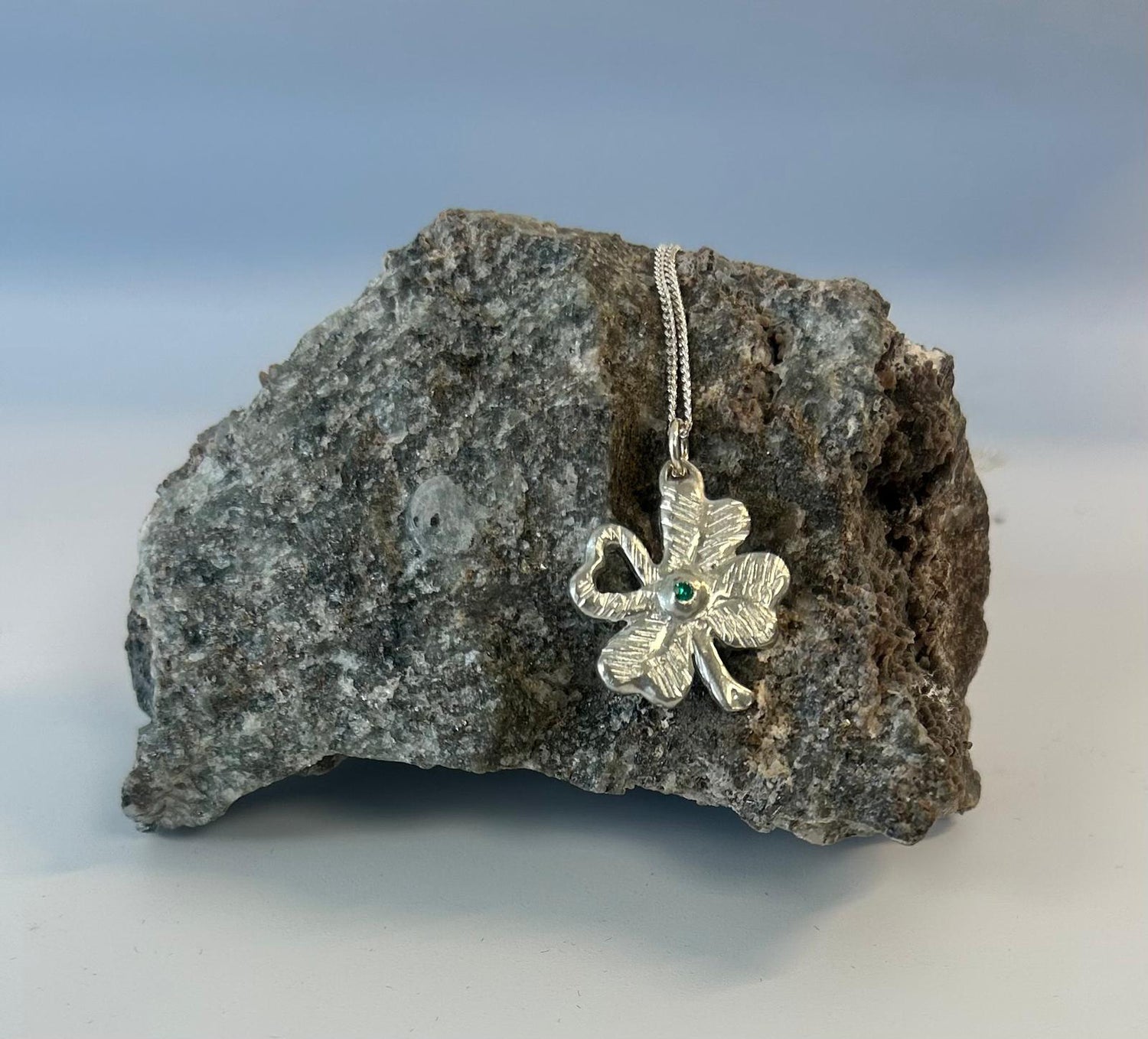 Four leaf clover pendant with green stone