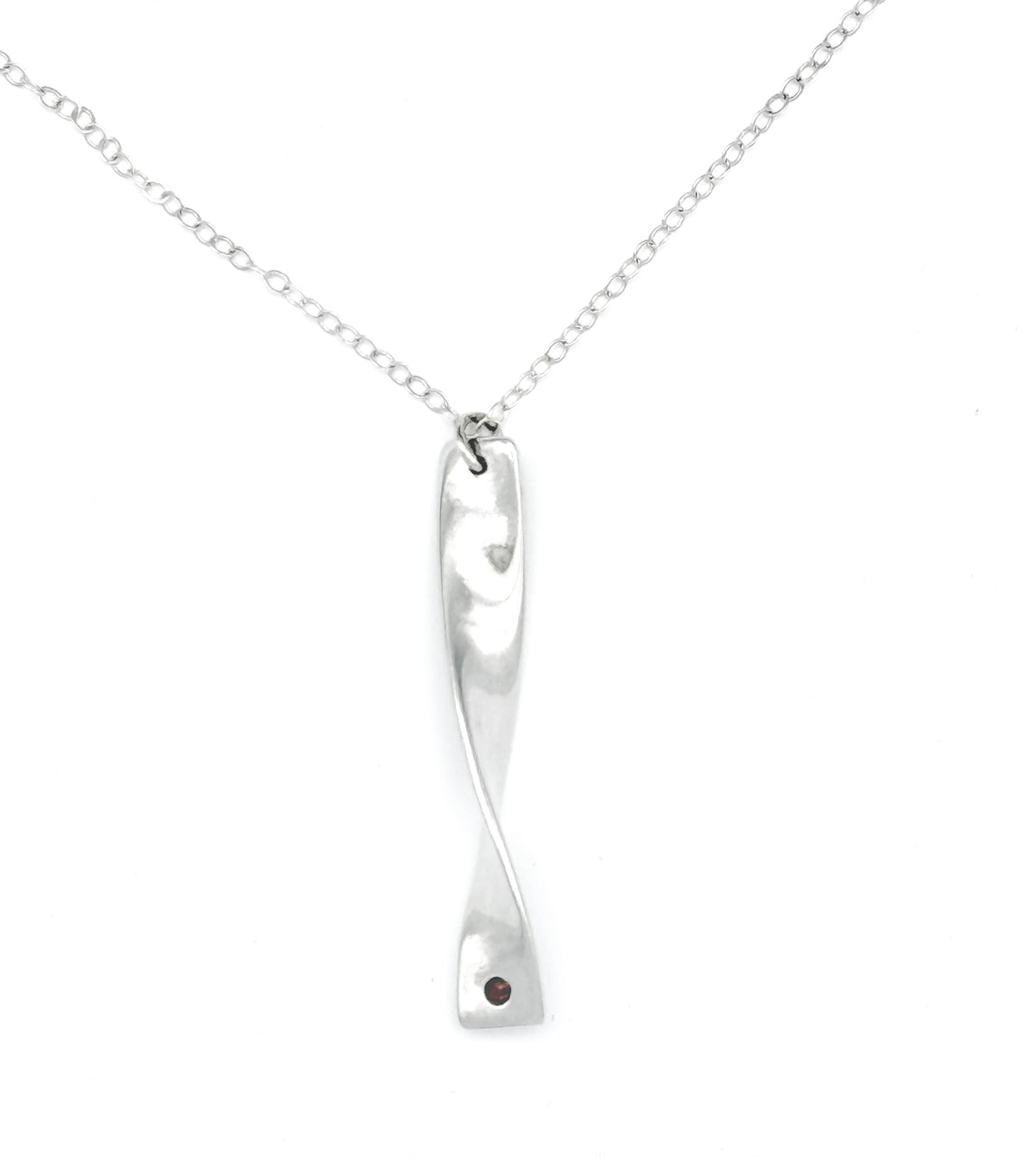 Cornish tin necklace which is silver in colour with a real ruby on a white background