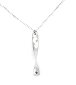 Cornish tin necklace which is silver in colour with a real ruby on a white background