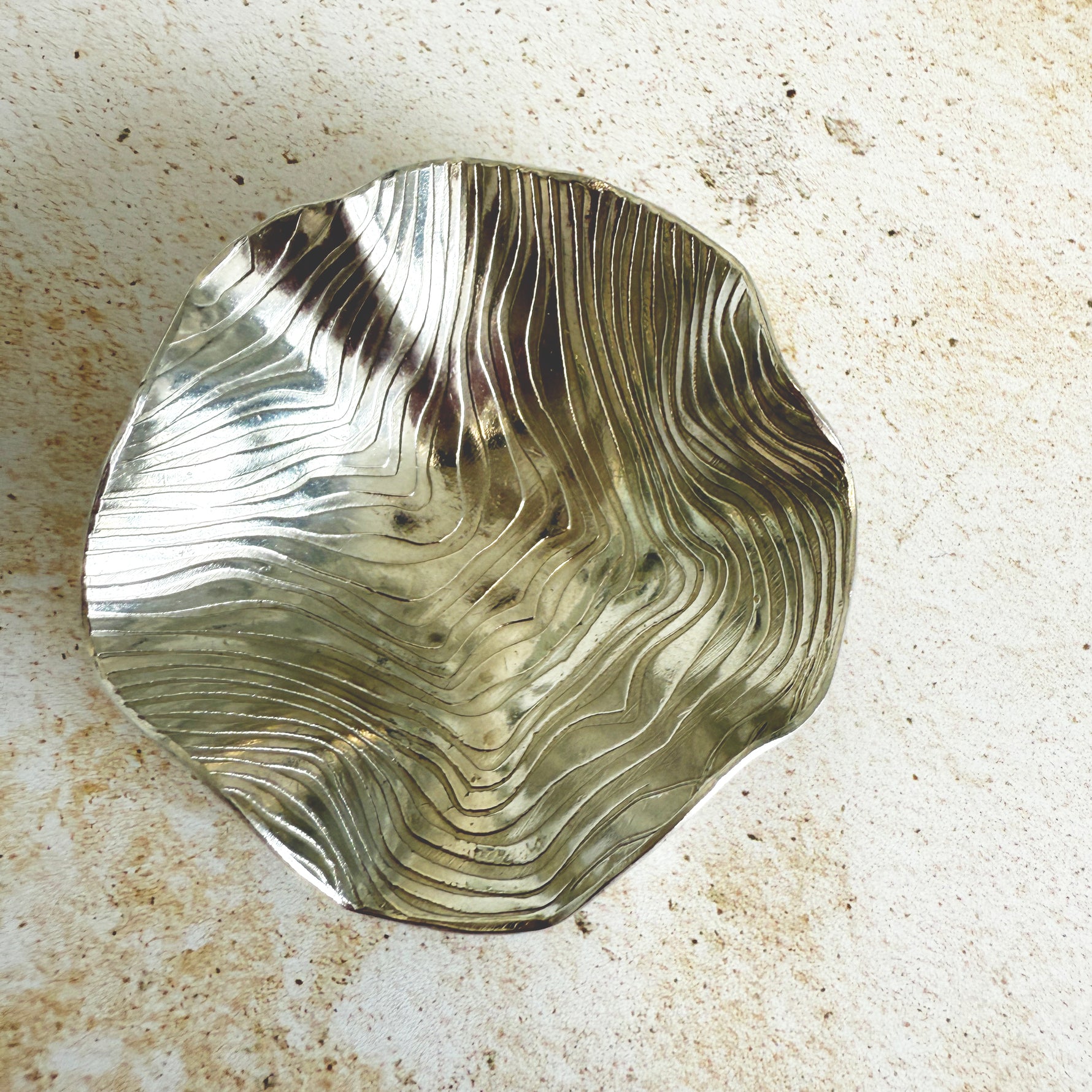 Rolled wave effect trinket dish with undulating edges